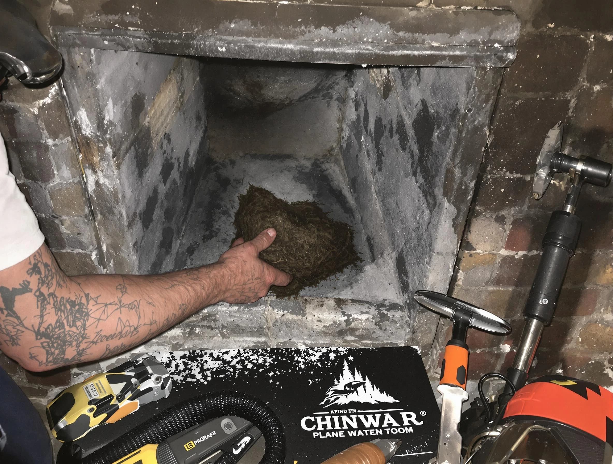 Fairburn Chimney Sweep safely removing debris and screening chimney in Fairburn, GA