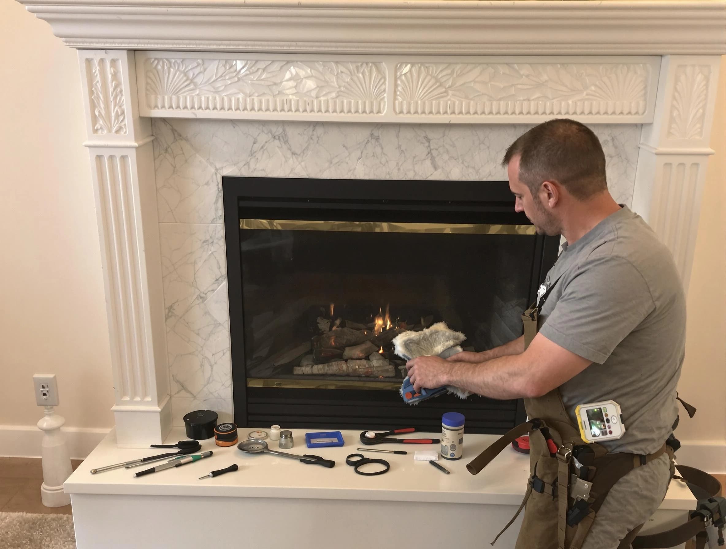 Fairburn Chimney Sweep performing fireplace maintenance in Fairburn, GA